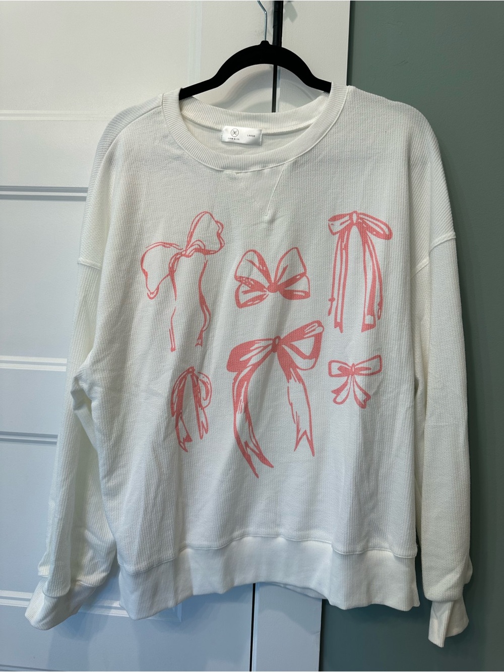 White Pullover Sweatshirt with Pink Bow Prints